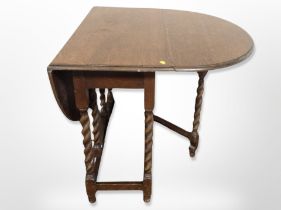 An oak barley twist gateleg dining table,