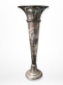 A loaded silver trumpet vase, height 20.