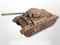 A wooden money box in the form of a tank,