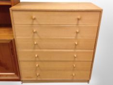 A 20th century Danish oak veneered six drawer chest,