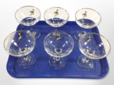 A set of six Babycham glasses,