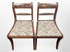 A pair of 19th century mahogany dining chairs in the Regency style