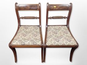A pair of 19th century mahogany dining chairs in the Regency style