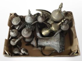 A box of Islamic brass and copper coffee pots