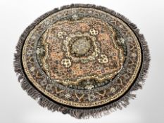 A circular Persian-design rug,