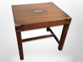 A mahogany brass mounted lamp table,