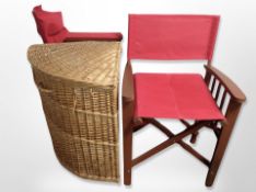 A wicker corner hamper and two folding chairs