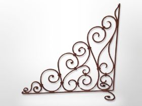 A painted wrought metal bracket,