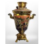 A decorative enamelled brass tea urn,