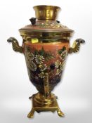 A decorative enamelled brass tea urn,