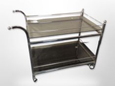A chrome and smoked glass two tier drink's trolley,