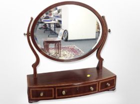A Victorian inlaid mahogany bow fronted dressing table mirror,