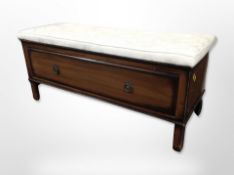 A reproduction single drawer low chest with cushion seat,