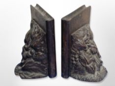 A pair of carved oak bookends,
