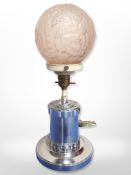 An Art Deco chrome and pink frosted glass table lamp,