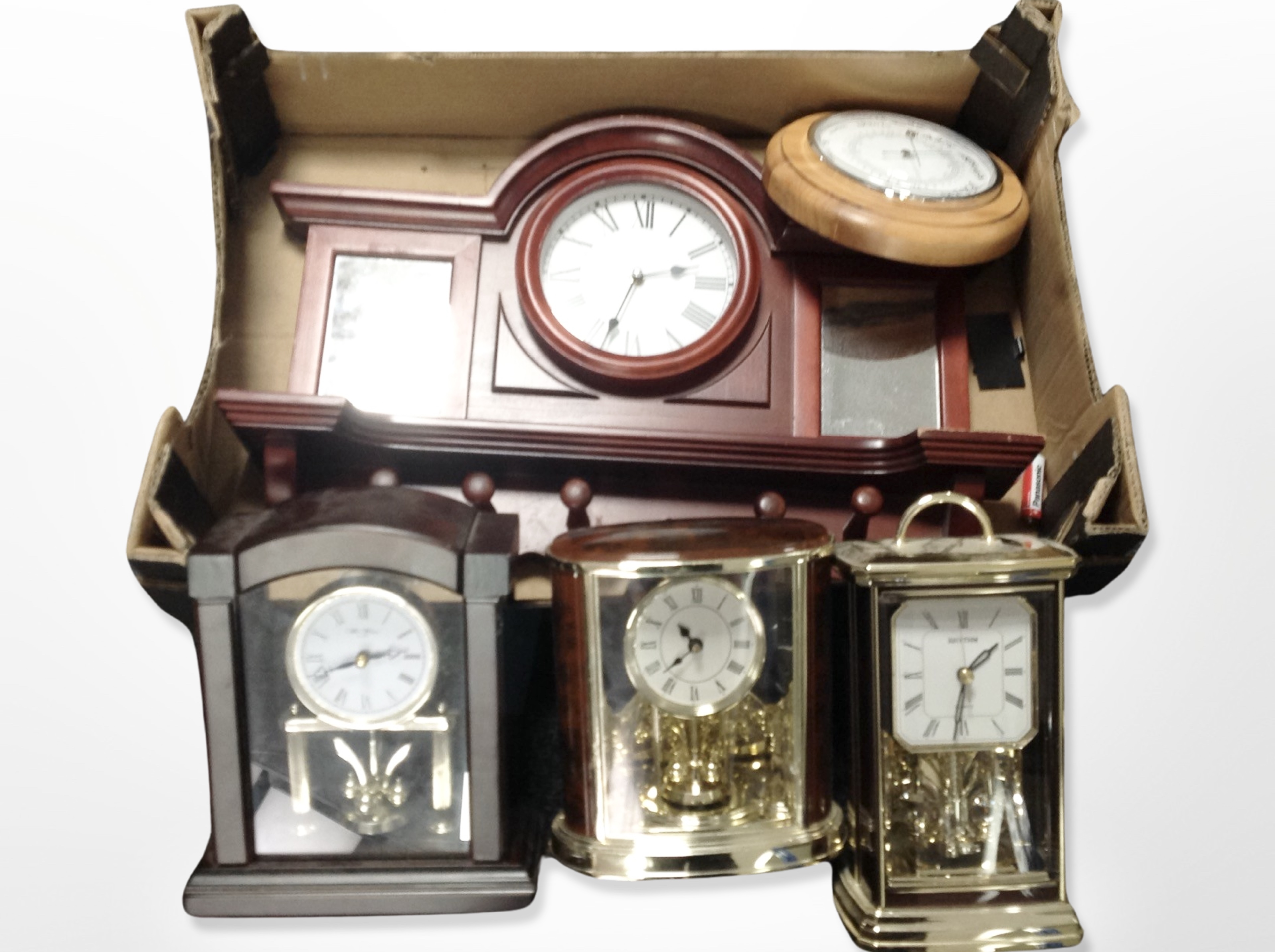 A box of contemporary mantel timepieces, barometer,