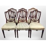 A set of six reproduction mahogany shield back dining chairs