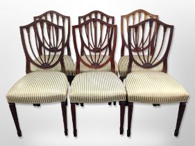 A set of six reproduction mahogany shield back dining chairs