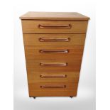 A Schreiber teak six drawer chest,
