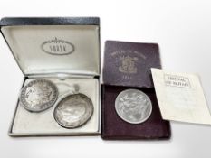 An American Silver Dollar, 1881, together with a 1935 Crown and a 1951 Festival of Britain Coin,