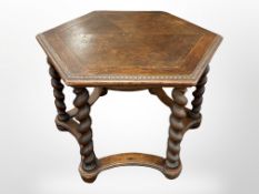 An early 20th century oak hexagonal occasional table,