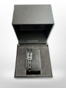 A Lady's Gucci wristwatch set with two diamonds in retail box
