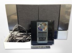 A Bang & Olufsen Beosound system, pair of Beolab 4500 wall speakers and a box of remote,