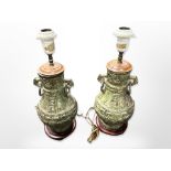 A pair of 20th century patinated metal lamp bases in the Chinese archaic style with ring handles on