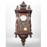 A 20th century mahogany Vienna wall clock with enamelled dial,
