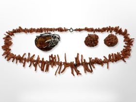 A coral necklace, earrings and a silver-mounted Baltic amber brooch.