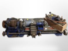 A group of workshop tools including lathe, two motors,