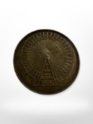 A Victorian coin depicting 'The Gigantic Wheel' Earls court London.