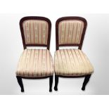 A pair of mahogany dining chairs on paw feet