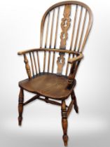 A 19th century elm spindle back kitchen armchair,