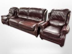 A Wade three-piece stitched Burgundy leather lounge suite, comprising of a three-seater settee,