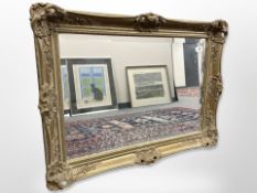 An antique-style gilt-framed mirror, 80cm x 60cm.