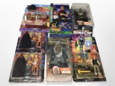 A group of Mattel and other figurines, including Last Action Hero,