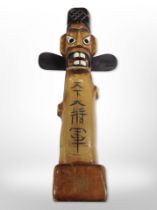 A Korean carved and painted wood jangseung guardian totem, height 27cm.
