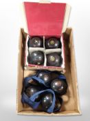A set of four Sterling slimline lawn bowls, and a further set of four Henselite bowls.