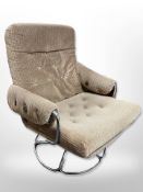 A 20th century chrome lounge chair in oatmeal fabric