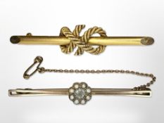 A 15ct gold rope twist bar brooch and a 9ct gold aquamarine and seed pearl brooch