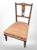 A Victorian rosewood and satin wood inlaid salon chair