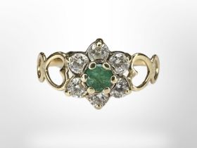 A 9ct yellow gold emerald and cubic zirconia dress ring