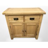 A contemporary oak side cabinet,