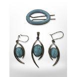 A silver and faux turquoise pendant, matching earrings,