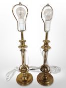 A pair of brass lamp bases, height 44cm (continental plugs).