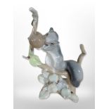 A Lladró figure of a squirrel perched on a branch, height 22cm.