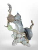 A Lladró figure of a squirrel perched on a branch, height 22cm.