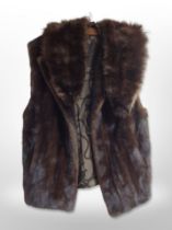 A vintage brown mink lady's sleeveless jacket and a stole