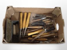 A collection of vintage wood, masonry, and engraving chisels.